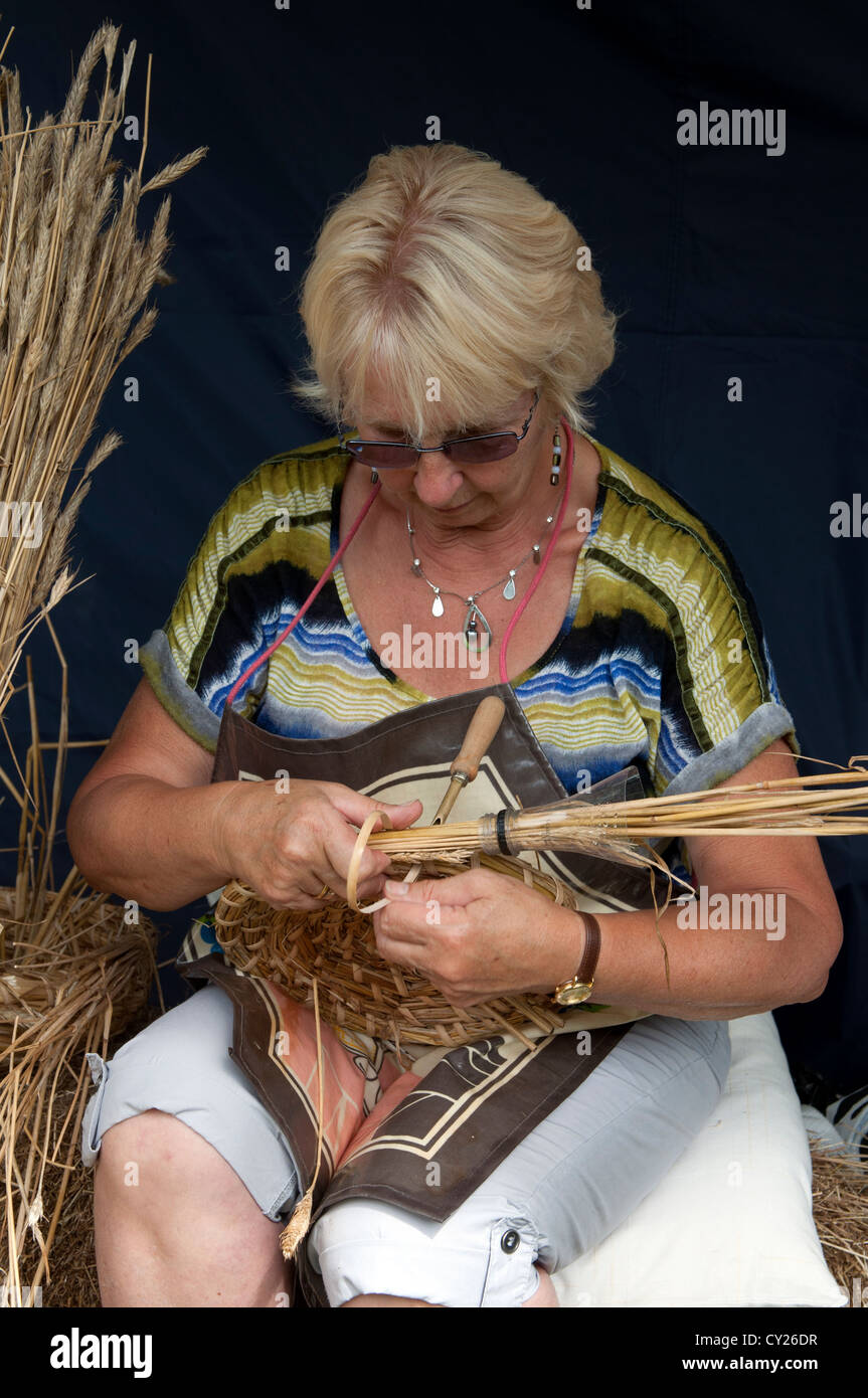 Woman making traditional beekeeper`s skep Stock Photo